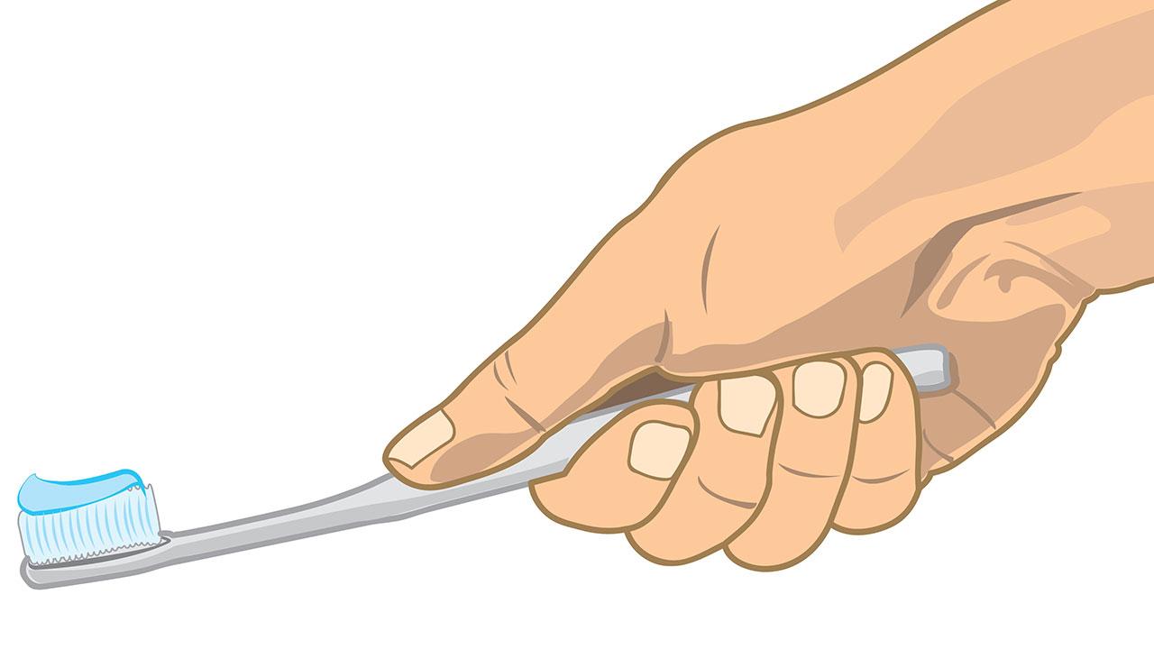 Tegnet hånd holder om en ditto tandbørste