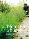 Med blomster på huden